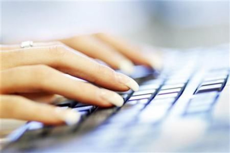 A woman uses a computer keyboard in this photo illustration taken in Sydney