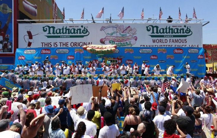 Contestants take part in Nathan&#039;s annual hot dog eating contest in the Coney Island section of New York