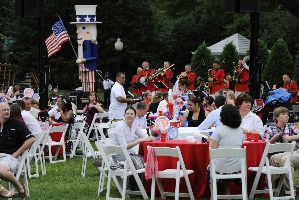 Families of U.S. servicemen and women attend an Independence Day barbeque at the White House in Washington