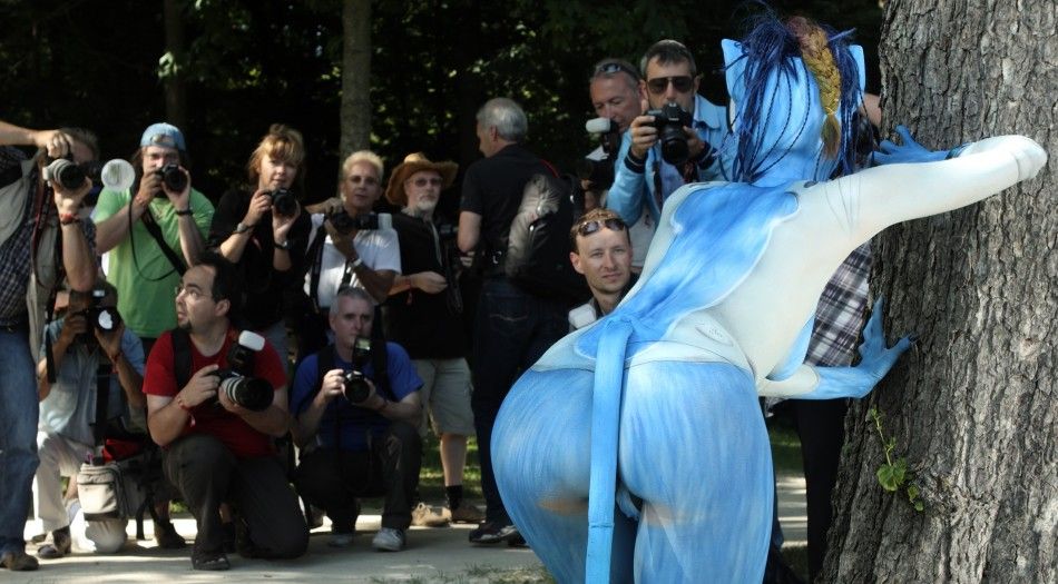 A model poses for photographers during the annual World Bodypainting Festival in Poertschach