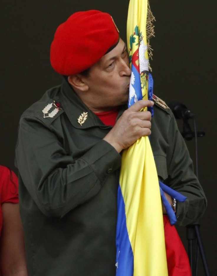 Venezuela's President Hugo Chavez kisses the national flag 