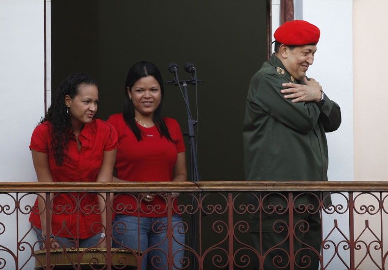 Venezuelas President Hugo Chavez greets supporters