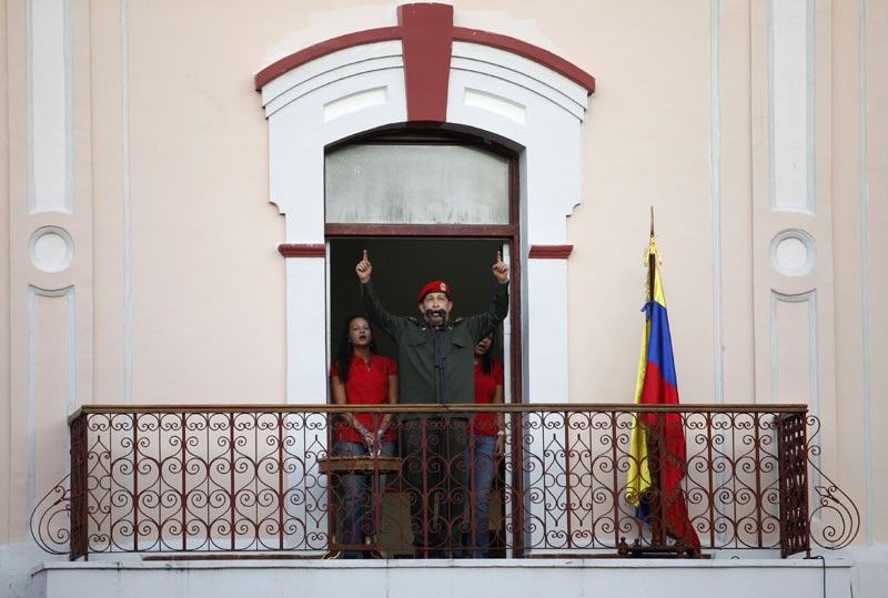 Venezuelas President Hugo Chavez greets supporters
