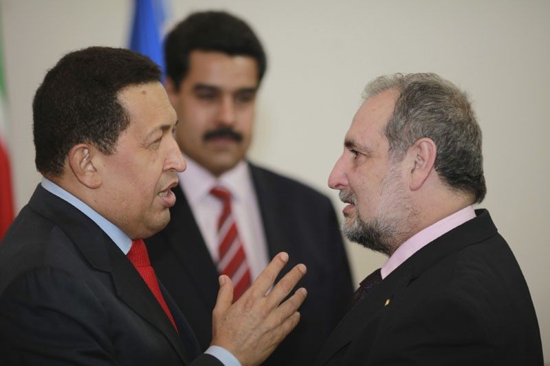Venezuelas President Hugo Chavez L speaks with Paraguays Foreign Minister