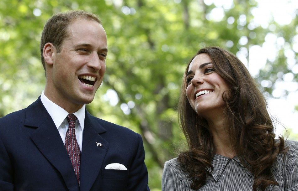 Britain039s Prince William and his wife Catherine, Duchess of Cambridge, laugh during a tree planting ceremony at Rideau Hall in Ottawa July 2, 2011.