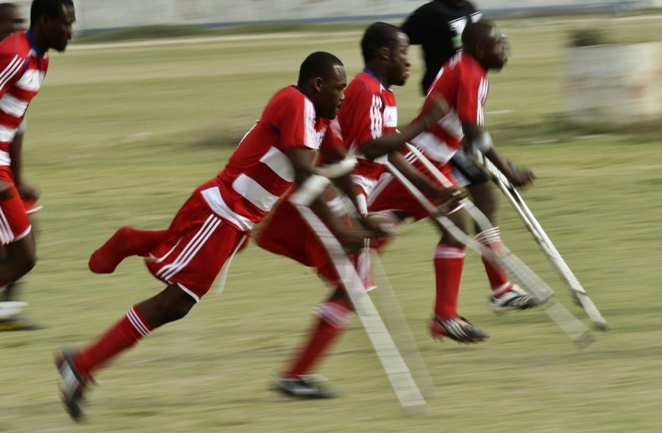 Haitian soccer players of the national amputee team warm up before a friendly match against Zaryen team in Port-au-Prince