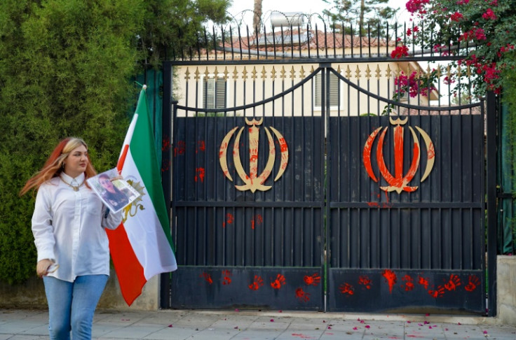 The entrance of Tehran's embassy is covered in red paint and palm prints during a rally organised by Iranian expats in support of protests in Iran