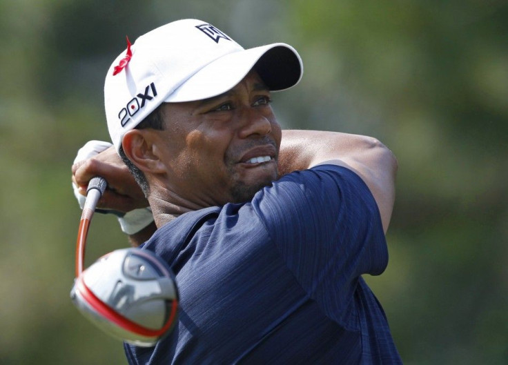 Woods of the US hits off the ninth tee during first round play of the Players Championship golf tournament in Ponte Vedra Beach