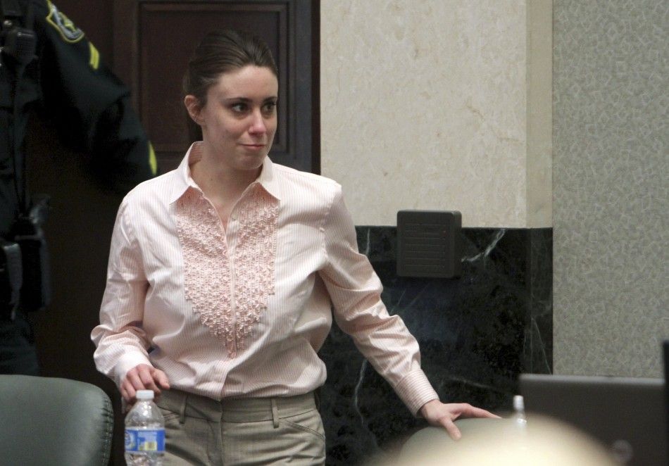 Casey Anthony smiles as she returns to the defense table 