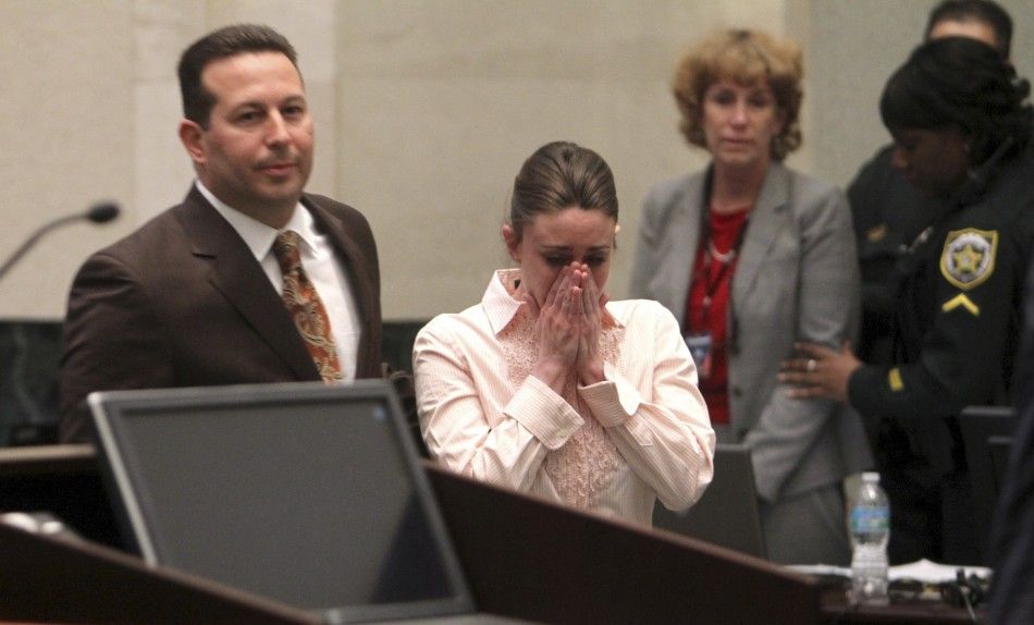 Casey Anthony approaches the podium to hear Judge Belvin Perry confirm that she is not guilty on first degree murder charges of her daughter Caylee at the Orange County Courthouse Orlando