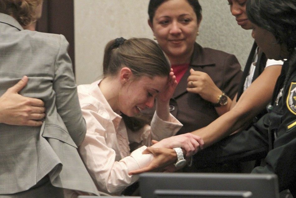 Casey Anthony C reacts with her defense team following her acquittal in Orlando