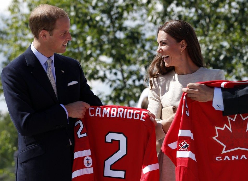 Britain039s Prince William and his wife Catherine, the Duchess of Cambridge, are given hockey jerseys during a visit to the Somba K039e Civic Plaza in Yellowknife