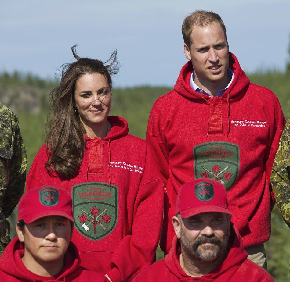 Britain039s Prince William and his wife Catherine pose wearing the sweaters of the Canadian Rangers during a visit to Blatchford Lake