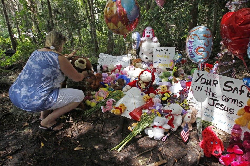Marie Chalabi of Orlando places a toy bear at the wooded location of where the body of Caylee Anthony was found in 2008, in Orlando