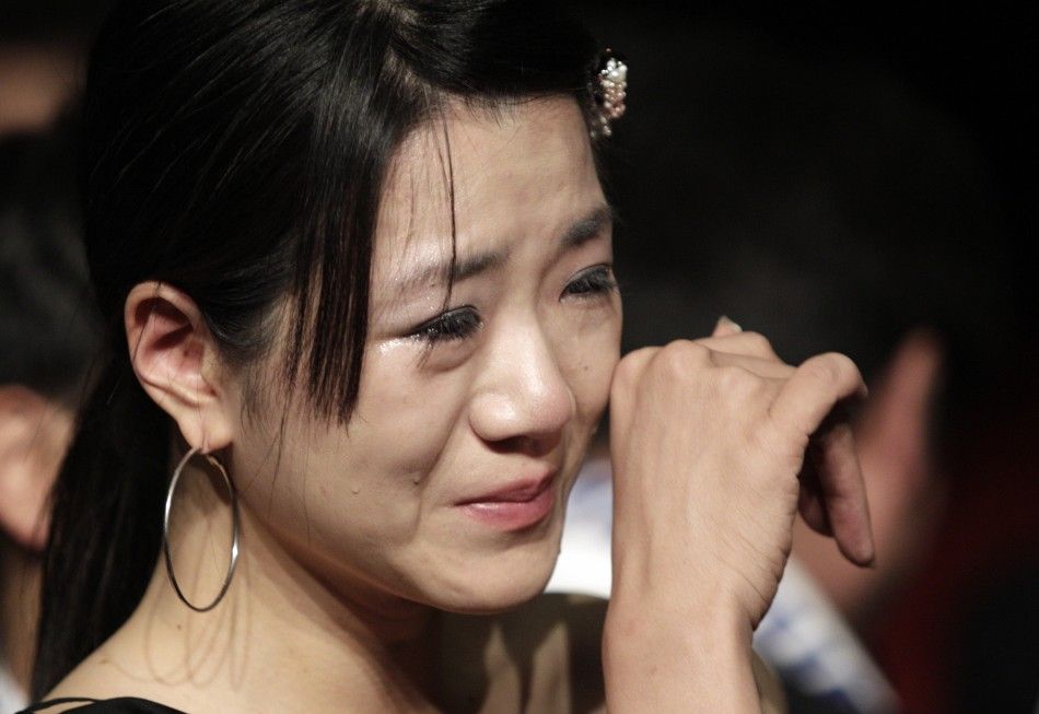 A member of the Pyeongchang 2018 bid committee cries after the announcement