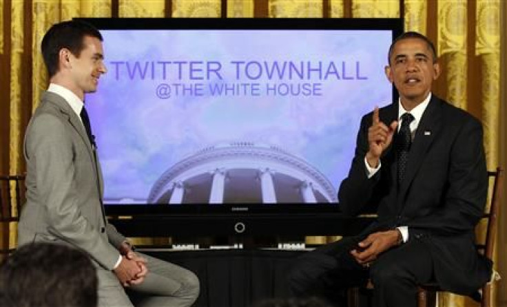 Obama talks to the audience next to Jack Dorsey during his first ever Twitter Town Hall in the East Room at the White House in Washington