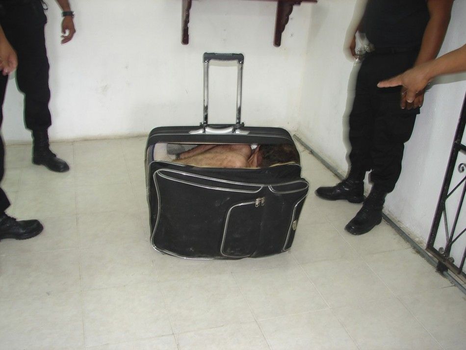Handout photo shows an inmate hiding in a suitcase during an escape attempt from a prison in Chetumal