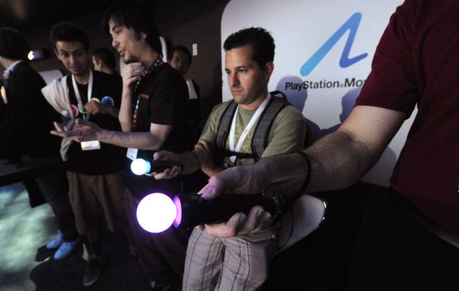 Attendees try out the Sony PlayStation 3 at the E3 Media & Business Summit in Los Angeles.