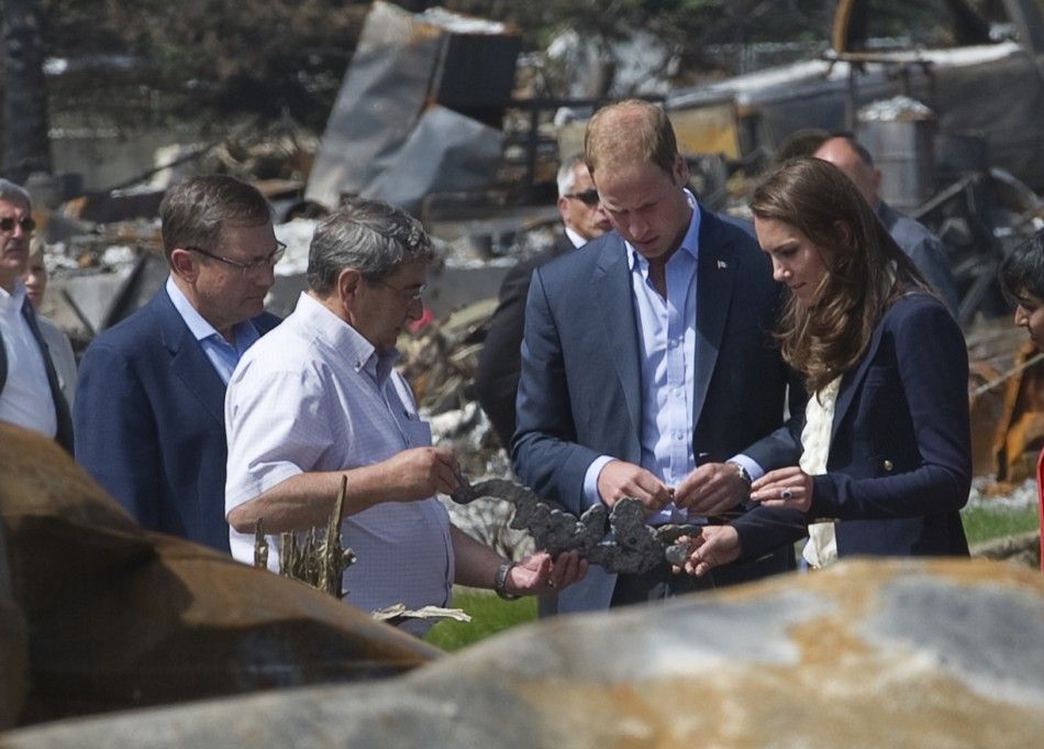 Britain039s Prince William and his wife Catherine, Duchess of Cambridge, talk with Premier Stelmech and City Reeve Garratt as they visit a fire-devastated town in Slave Lake