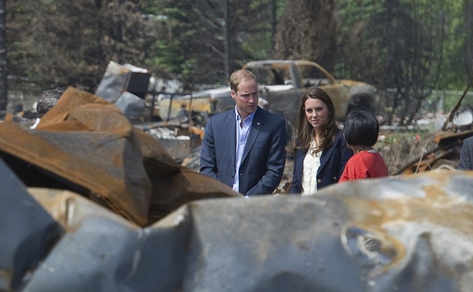 Britain039s Prince William and his wife Catherine, Duchess of Cambridge, talk with Mayor Pillay-Kinnee as they visit a fire-devastated town in Slave Lake, Alberta