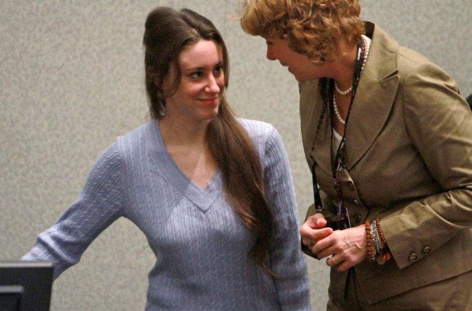 Casey Anthony L speaks with her attorney Dorothy Clay Sims as she enters the court for her sentencing at the Orange County Courthouse in Orlando, Florida, July 7, 2011.