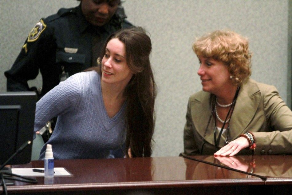 Casey Anthony L takes her seat next to her attorney Dorothy Clay Sims during her sentencing at the Orange County Courthouse in Orlando, Florida, July 7, 2011.