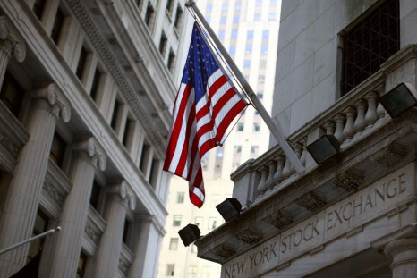 A U.S. flag flies outside an entrance to the New York Stock Exchange