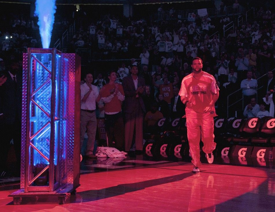 New Jersey Nets point guard Deron Williams is introduced to the crowd before the Nets played the Phoenix Suns in their N