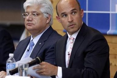 Research in Motion co-CEO Jim Balsillie and President and co-CEO Mike Lazaridis listen during the annual general meeting of shareholders in Waterloo