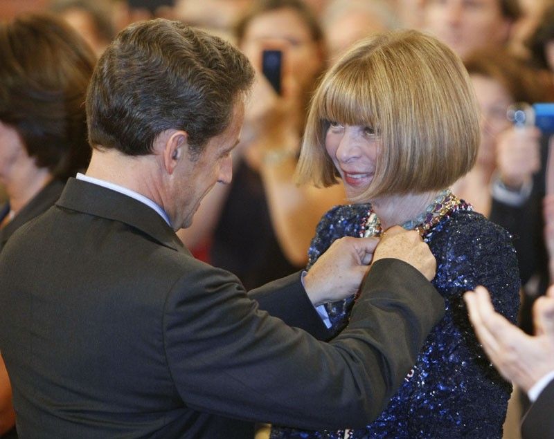 Frances President Nicolas Sarkozy L presents the Medal to Wintour