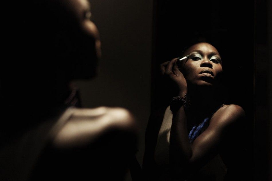 Senegalese model Sachakara Dieng applies make-up