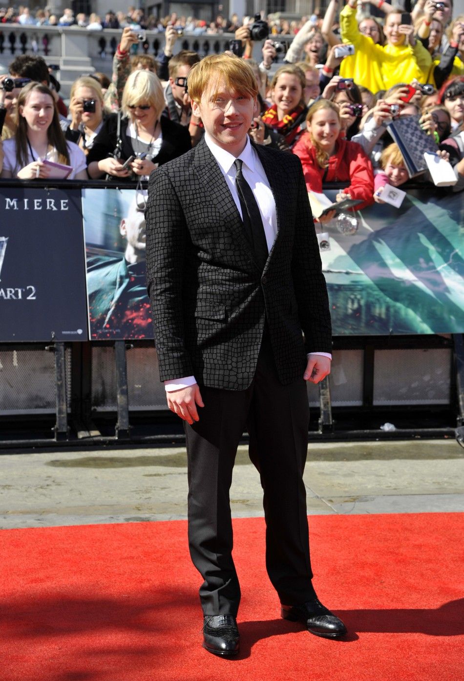 Actor Grint poses for pictures in front of fans as he arrives for the world premiere of quotHarry Potter and the Deathly Hallows - Part 2quot in Trafalgar Square, in central London