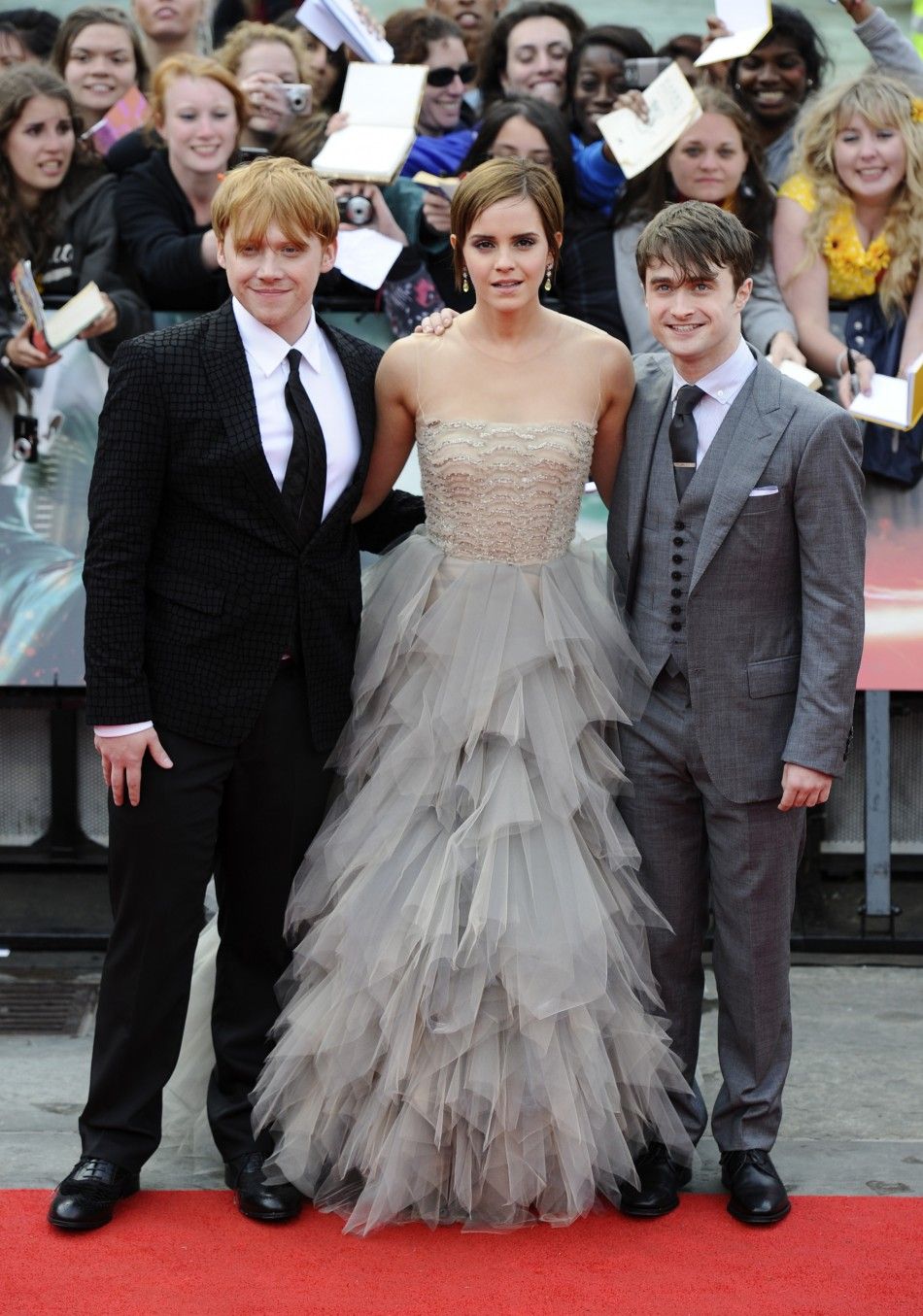 Watson poses with actors Grint and Radcliffe at the world premiere of quotHarry Potter and the Deathly Hallows - Part 2quot in Trafalgar Square, in central London