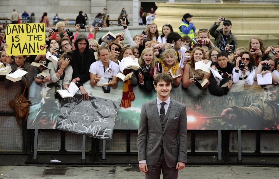 Actor Daniel Radcliffe smiles as he arrives for the world premiere of quotHarry Potter and the Deathly Hallows Part 2quot in London