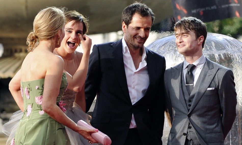 Emma Watson and co-stars bid tearful adieu at final Harry Potter premiere.