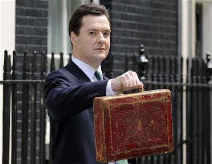 Chancellor George Osborne, holds Gladstone's old Budget box for the cameras outside 11 Downing Street