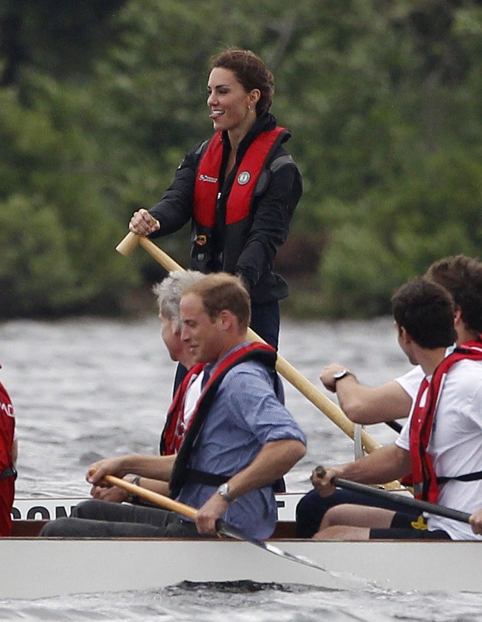 Britains Prince William and his wife Catherine, Duchess of Cambridge, compete in a dragon boat race in Dalvay-by-the-sea