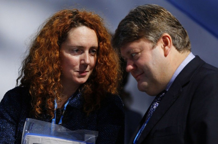 Britain&#039;s opposition Conservative Party&#039;s Leader of the House of Lords, Strathclyde, talks with CEO of News International, Wade, during the Conservative Party conference in Manchester