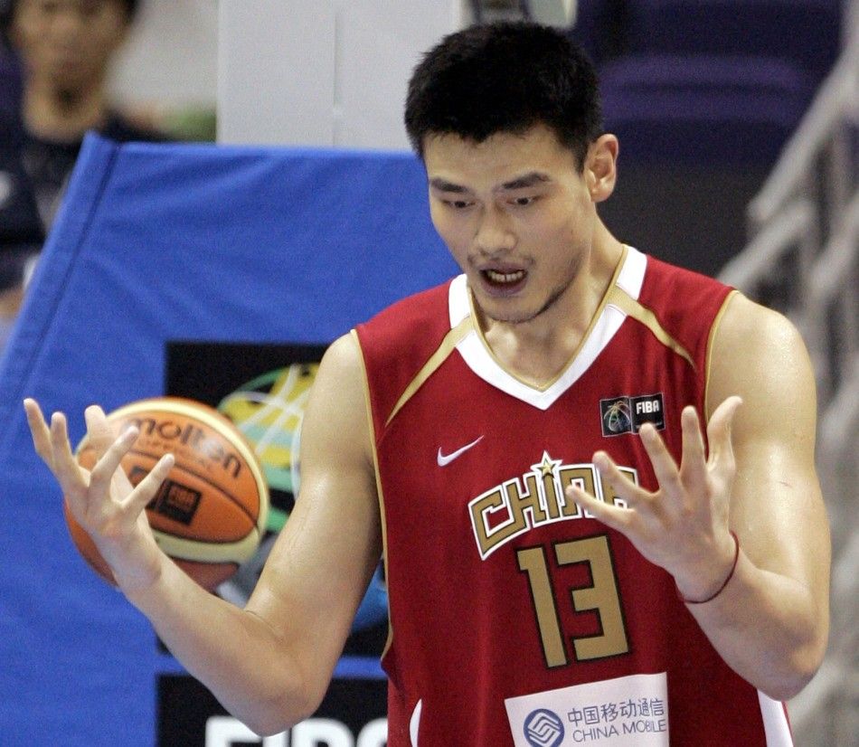 Chinas Yao celebrates their win against Senegal during the first round of the world basketball championships in Sapporo