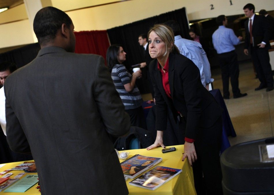 A recruiter for W.B. Mason Inc. speaks with a job seeker at a career fair at Rutgers University in New Brunswick
