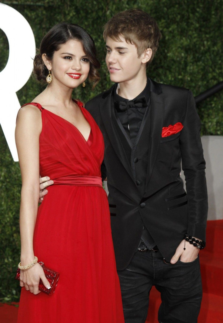 Singer Justin Bieber and singer Selena Gomez arrive at the 2011 Vanity Fair Oscar party in West Hollywood