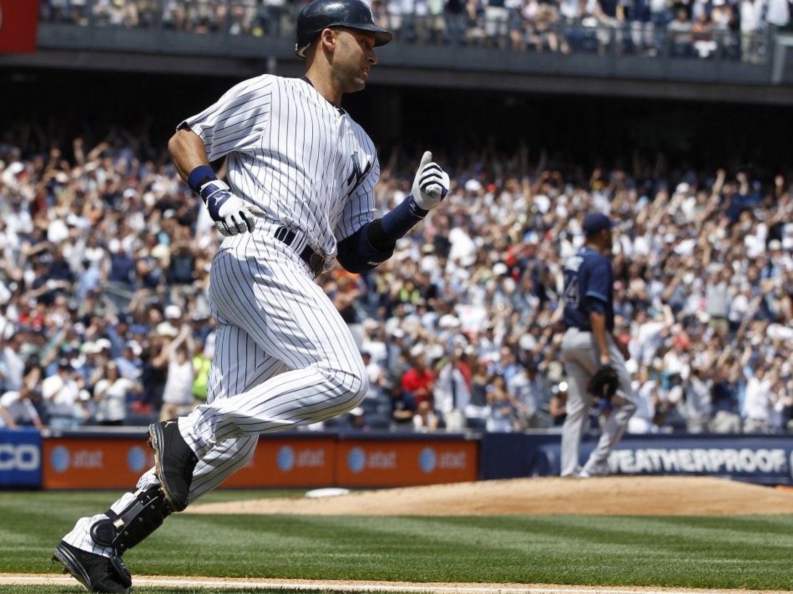New York Yankees' Derek Jeter hits a solo home run to left field in New York Yankees' Derek Jeter hits a solo home run to left field in