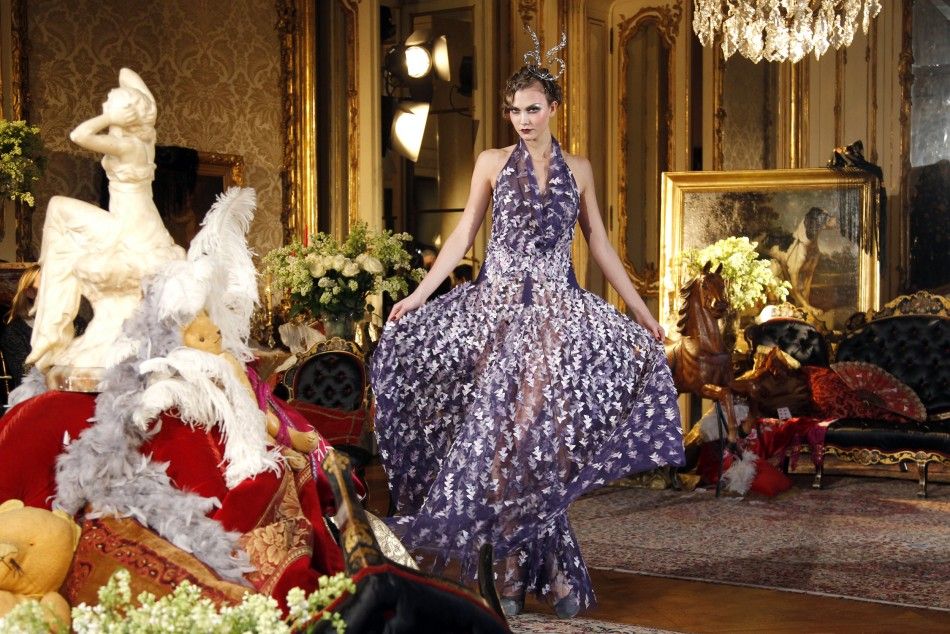 A model presents a creation by British designer John Galliano during Paris Fashion Week 