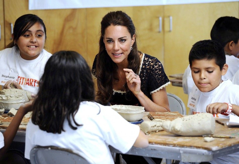 Catherine, Duchess of Cambridge attends a ceramics class with Joshua Valdivieso R and Stephanie Martinez L during her visit with her husband, Prince William at the Inner City Arts campus in Los Angeles, California