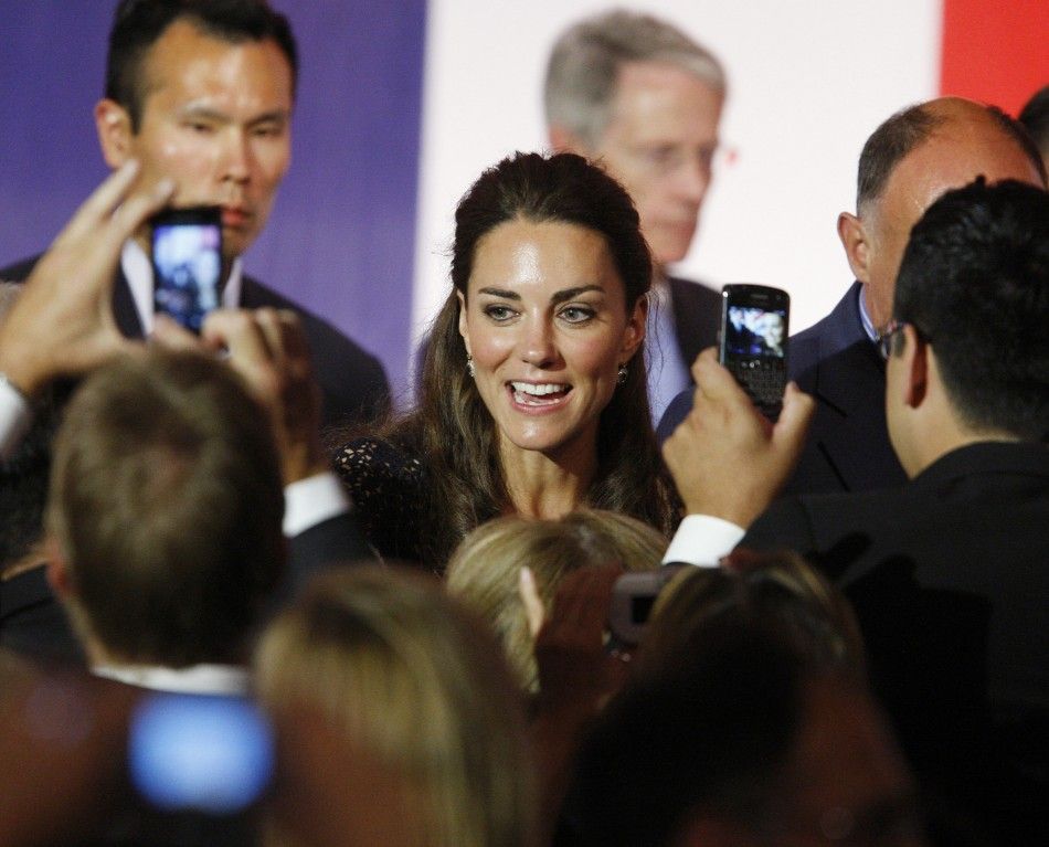 Britains Catherine, Duchess of Cambridge, greets spectators as she departs the Mission Serve Hiring Our Heroes event in Culver City, California