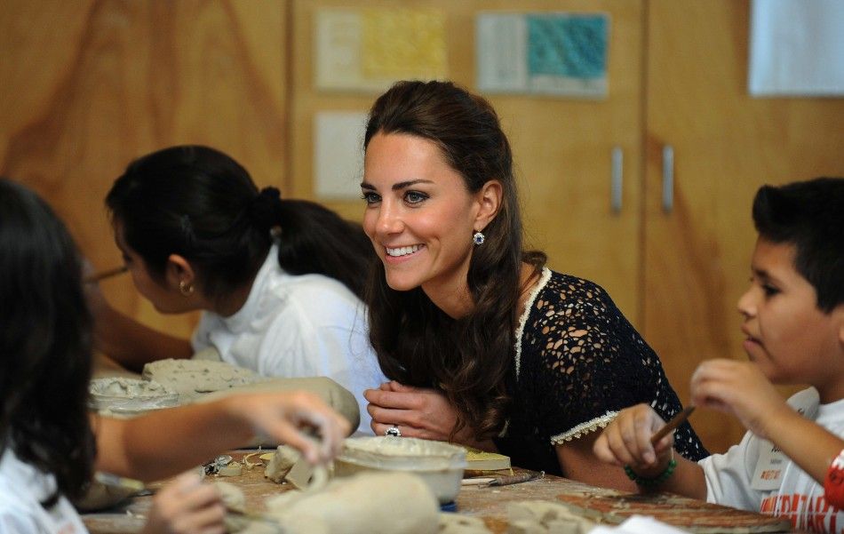 Catherine, the Duchess of Cambridge, works on a clay turtle project with students during a visit to the Inner-City Arts campus in Los Angeles