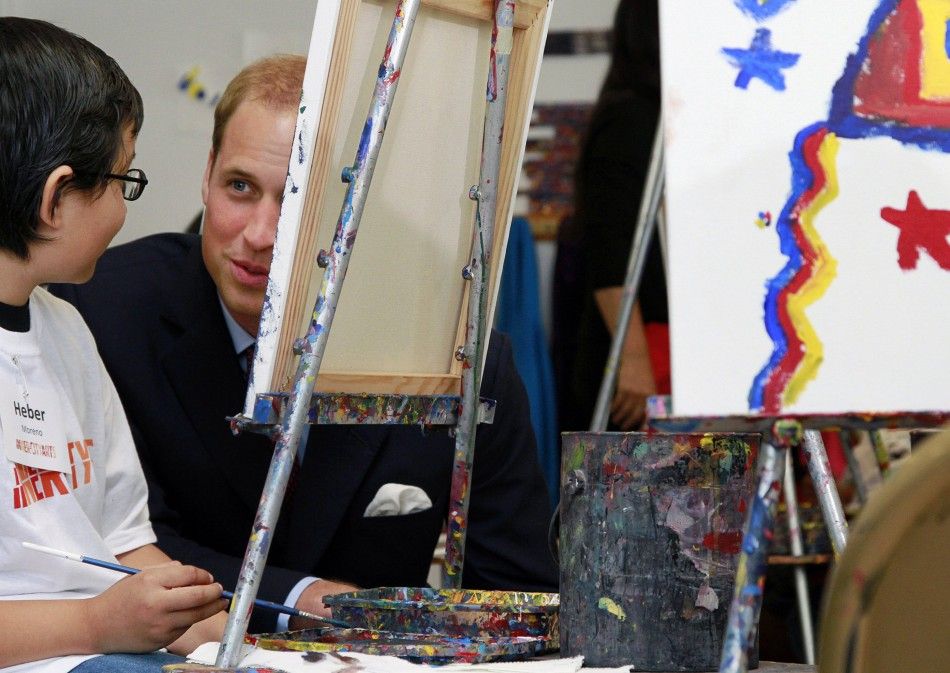 Heber Moreno talks with Britains Prince William during a tour of the Inner City Arts campus in Los Angeles California
