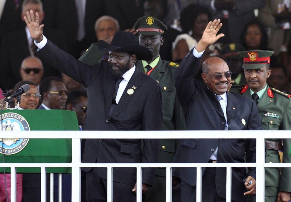 Sudanese Presidents wave to the crowd