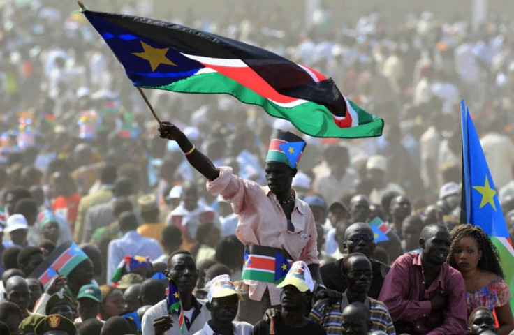 A man waves South Sudan&#039;s national flag