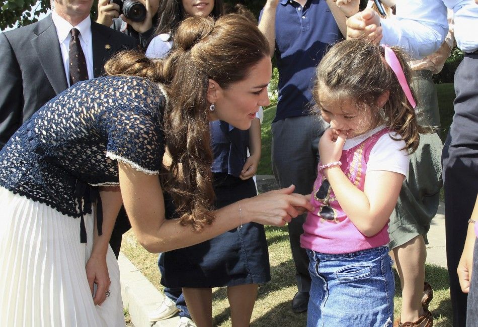 Catherine, Duchess of Cambridge, meets a member of the public during an impromptu walkabout outside their residence in Los Angeles